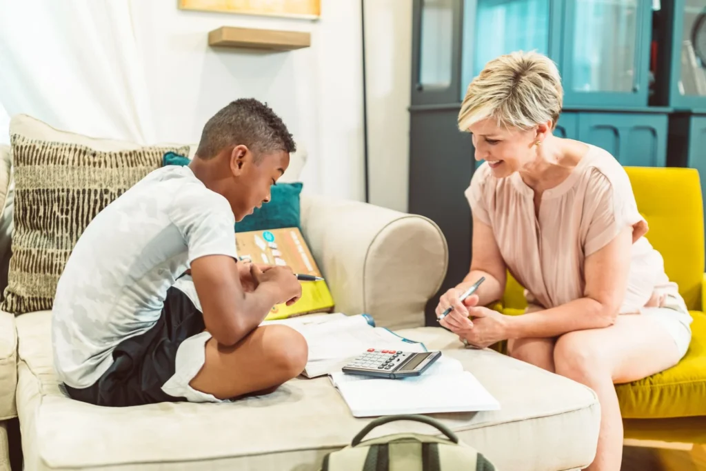 Mother reading with her child to prepare for the new school year.